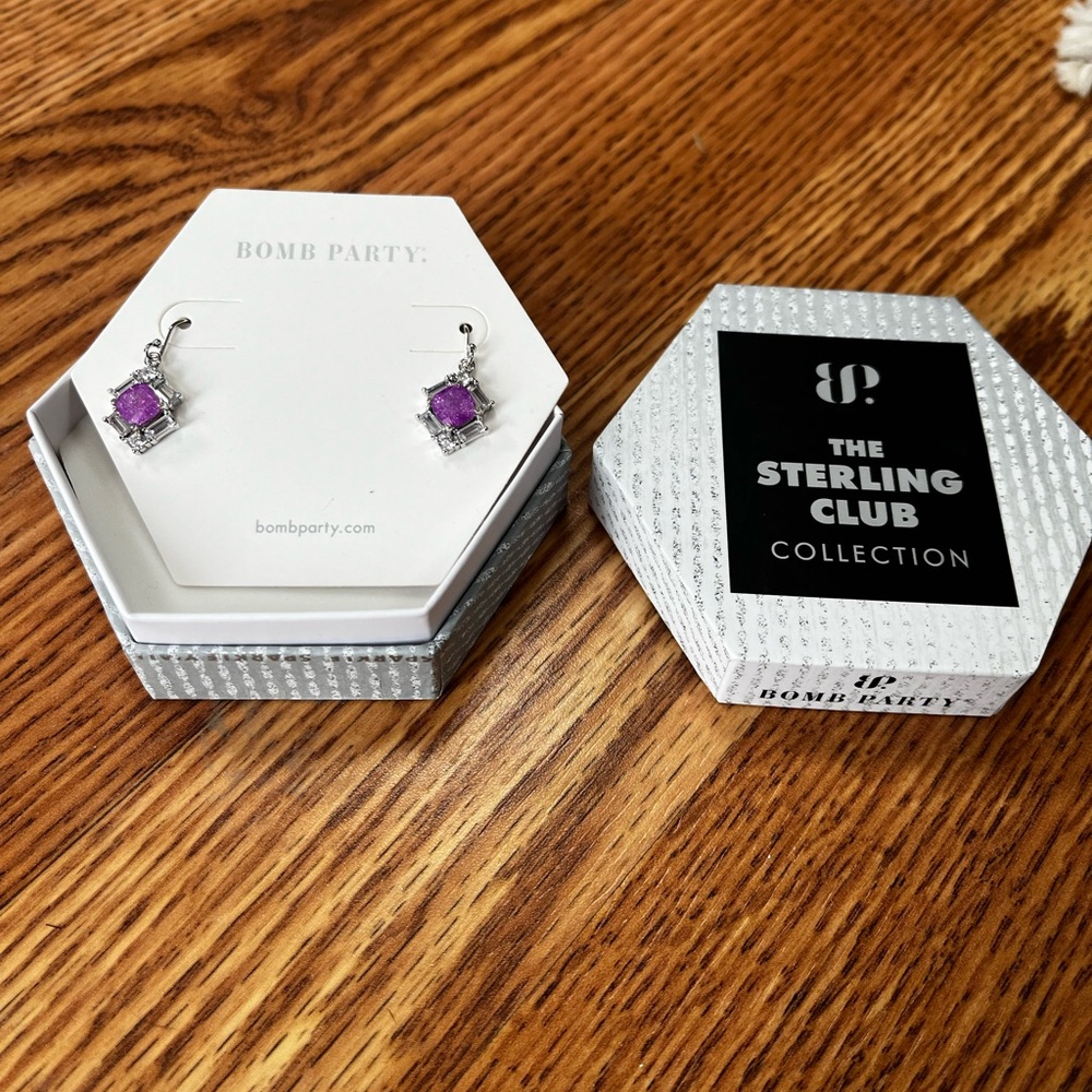 bomb party sterling silver earrings with purple stone